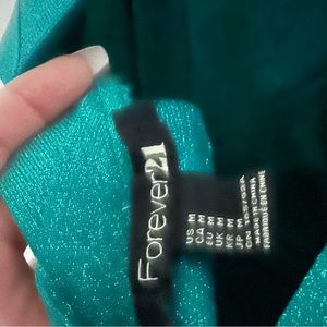 Forever 21 teal glitter dress. Runs a little small. Flattering on.